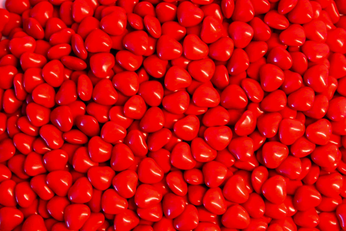 Shiny red heart candies bundle Stock Photos