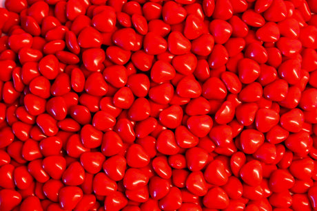 Shiny red heart candies bundle Stock Photos