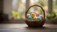 A wicker basket filled with pastel-colored Easter eggs rests on a wooden surface. The eggs feature light speckles and delicate patterns, creating a festive look. The background is softly blurred, showcasing greenery and warm natural light from a window. The scene exudes a calm and cheerful ambiance, perfect for spring or Easter celebrations. Ai generated. Photography style.