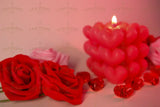 Blurred candlelight and roses bundle Stock Photos