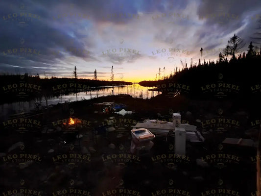 Campfire At Sunset With Cloudy Sky Stock Photos