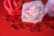 Close-up of delicate roses and scattered heart gems bundle Stock Photos