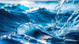 A close-up of ocean waves captures water splashing in motion. The deep blue tones of the waves contrast with the bright white reflections of sunlight. Droplets are frozen mid-air, showing intricate details of the splash. The smooth focus highlights the texture of the water, with a blurred background creating depth. The play of light and water enhances the natural beauty of the scene. Ai generated. Photography style.