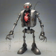 This cyberpunk character features a fusion of humanity and robotics, with a glowing red mechanical heart encased in a metallic torso. Its slender limbs, claw-like hands, and exposed cables emphasize its industrial origins. Designed with red-lens eyes and a rugged frame, it conveys a sense of determination and resilience, embodying the balance of emotion and engineered efficiency. Ai generated image.