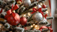 A beautifully adorned Christmas tree showcases red and silver baubles, each delicately decorated with snowflake patterns and vibrant red ribbons. Frosted branches add a wintry touch, while the soft glow of festive lights creates a warm and inviting ambiance. The intricate details and harmonious color palette capture the essence of holiday elegance and joy. Ai generated image.