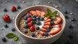 A smooth bowl of blended fruit is topped with sliced strawberries, blueberries, raspberries, granola, and a small sprig of mint. The soft beige bowl stands out on a simple gray surface. Loose berries and bits of granola are scattered around, making the dish look fresh and natural. The bright colors of the fruit create a lively and healthy feel. Ai generated. Photography style.