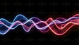 Digital image featuring smooth, flowing wave patterns in shades of blue, pink, and red against a black background. The waves intertwine, creating a layered effect with fine, curved lines adding texture. The glowing edges contrast with the dark background, enhancing depth and movement. The composition is balanced, with evenly spaced waves forming a dynamic visual rhythm. Ai generated. Photography style.