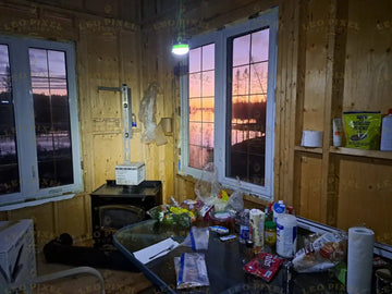 Inside Of A Wooden Cabin With Sunset View Stock Photos