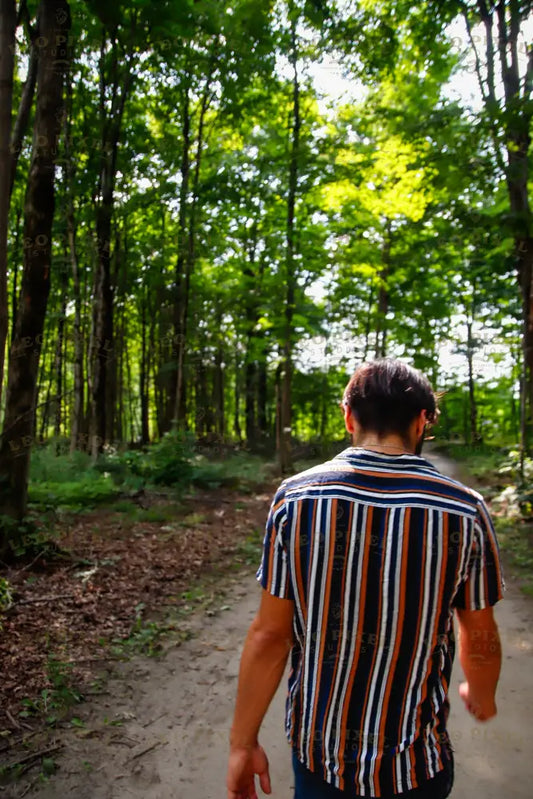 Portrait Of A Man Walking In The Forest Stock Photos