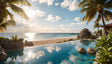 This photography-style image captures a tranquil beach with a luxurious infinity pool in the foreground. The water mirrors the blue sky with soft white clouds. Palm trees with long green fronds frame the scene, casting subtle shadows. Smooth rocks and tropical plants line the pool's edge. The sandy shore meets the calm turquoise ocean, with gentle waves and a golden sunset illuminating the horizon. Ai generated image.