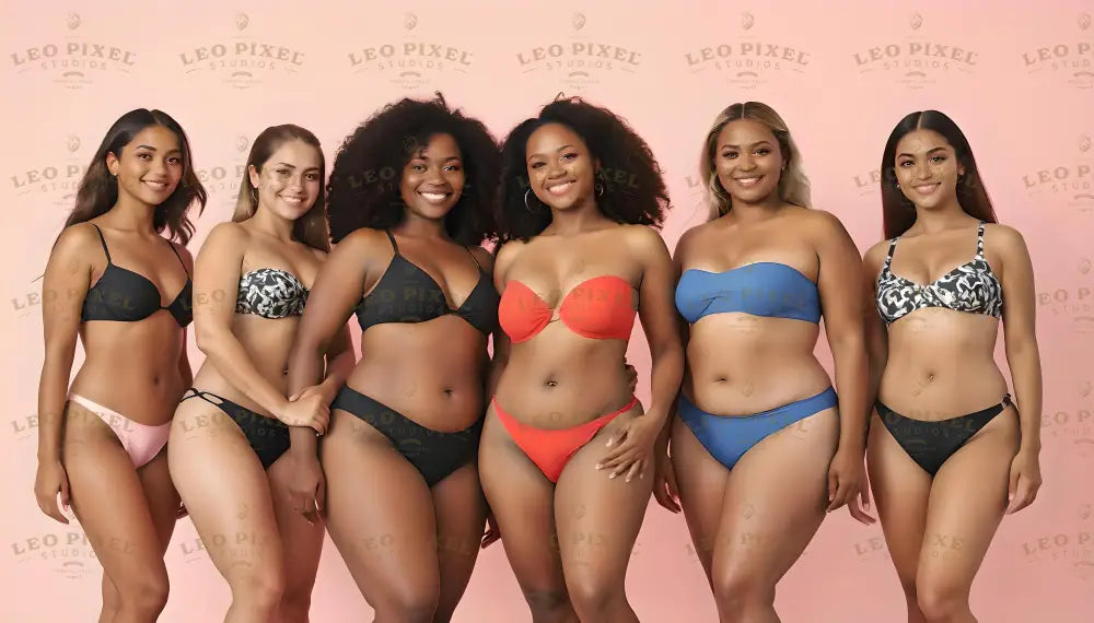 Six women stand together against a soft pink background, each wearing stylish bikinis in various colors and patterns. Their hairstyles range from natural curls to straight locks. Their warm smiles and confident poses emphasize individuality and beauty. The diverse swimwear includes black, blue, red, and patterned designs, enhancing the vibrant and cohesive look. Ai generated. Photography style.